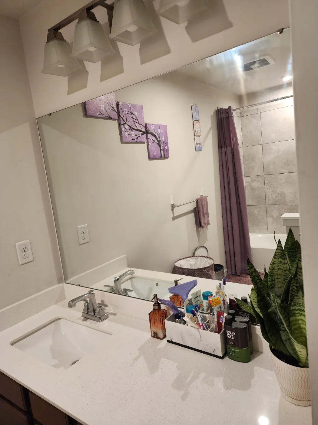 Bathroom mirror, sink and counter cleaned and polished