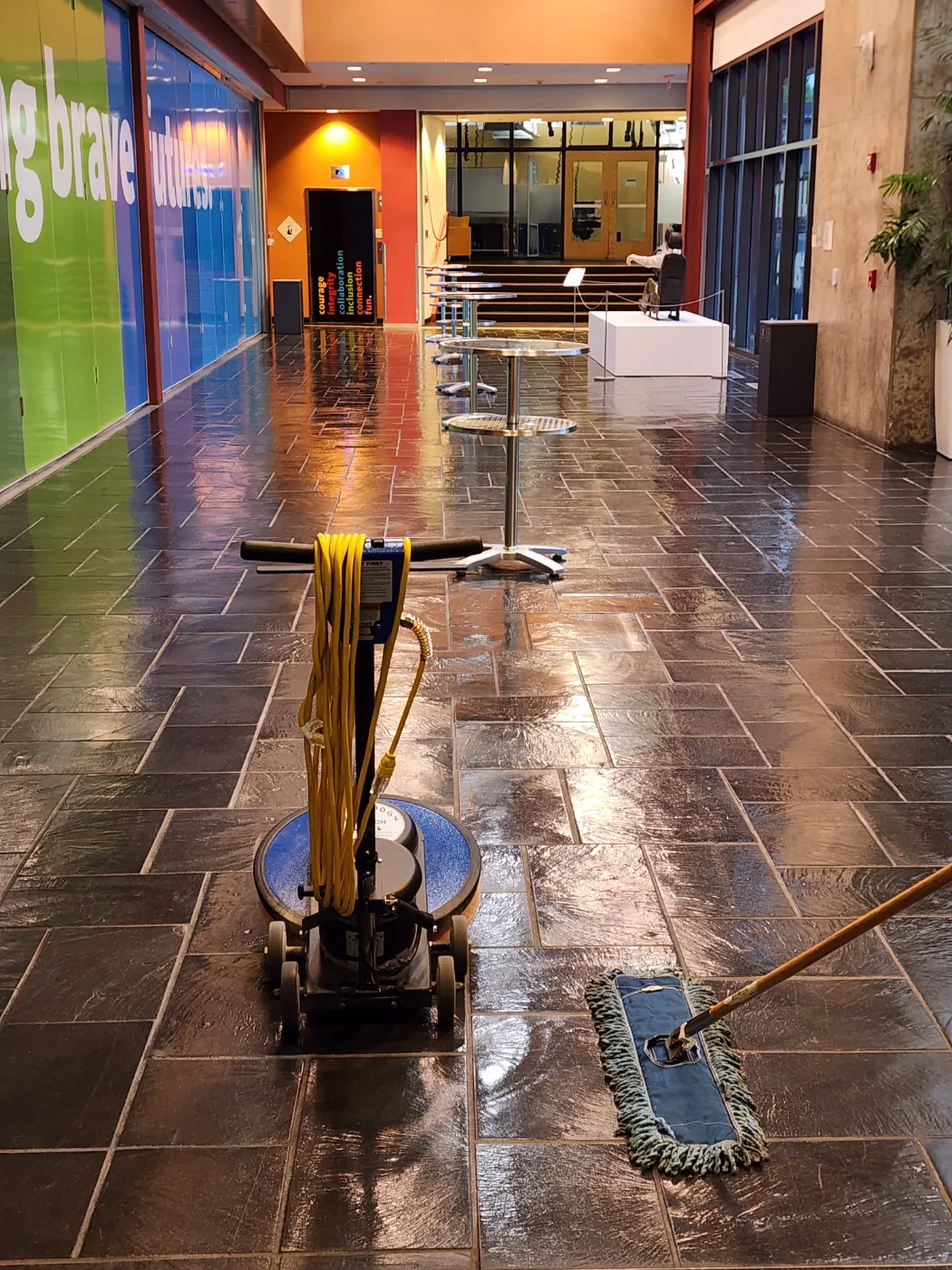 Commercial lobby tile floor scrubbed and mopped to a shine